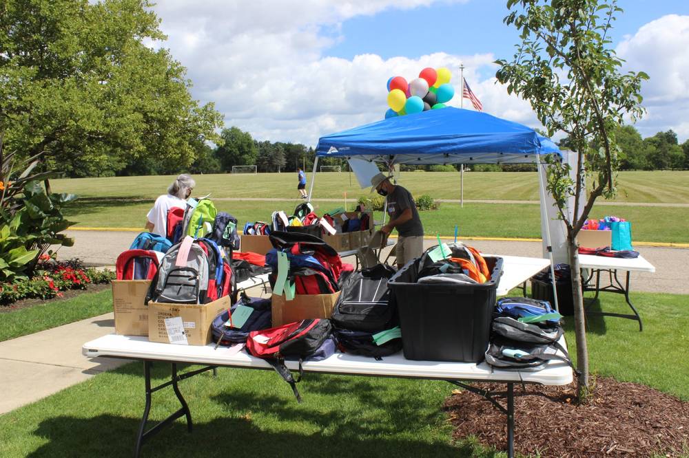 Backpacks Ready at the Distribution Table