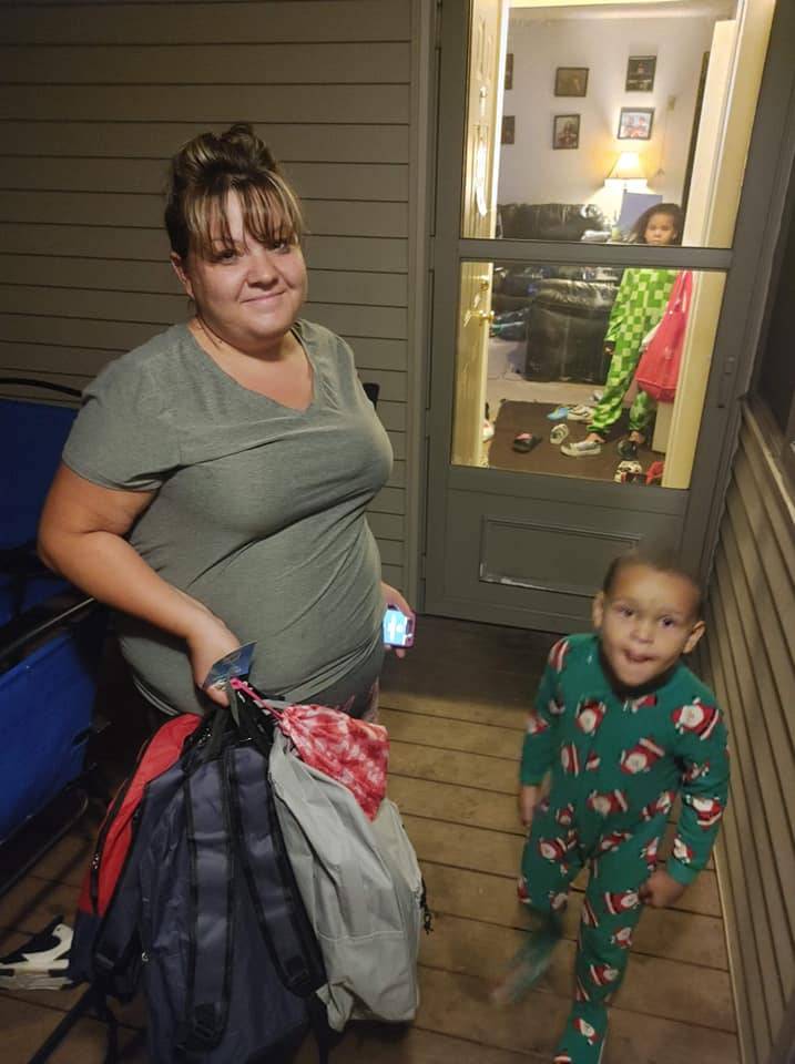 Family Receiving Backpacks at Home